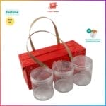 Red gift box with three clear containers