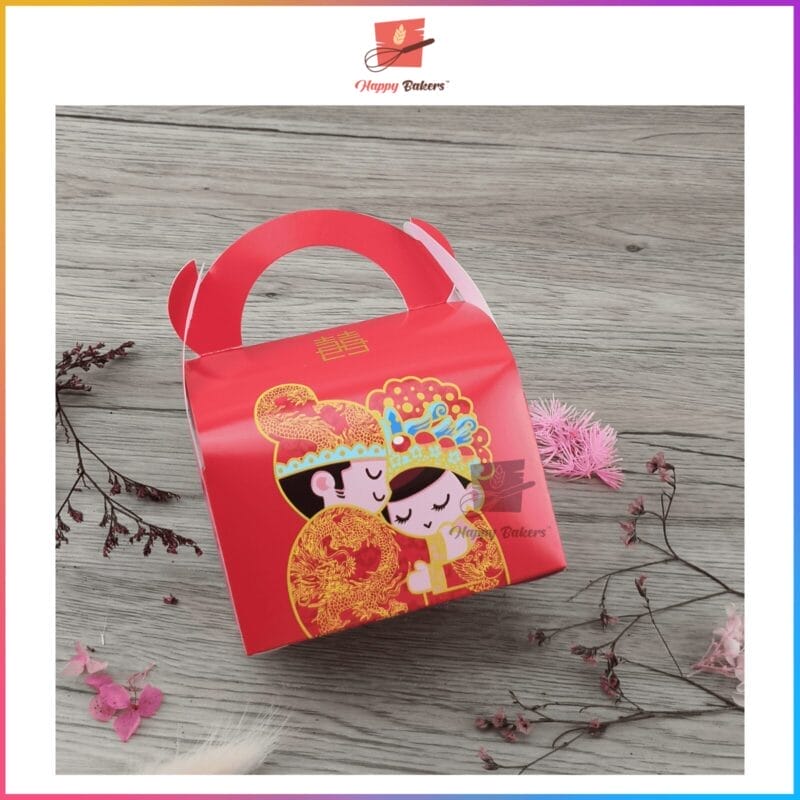 Red gift box with couple illustration and floral accents.